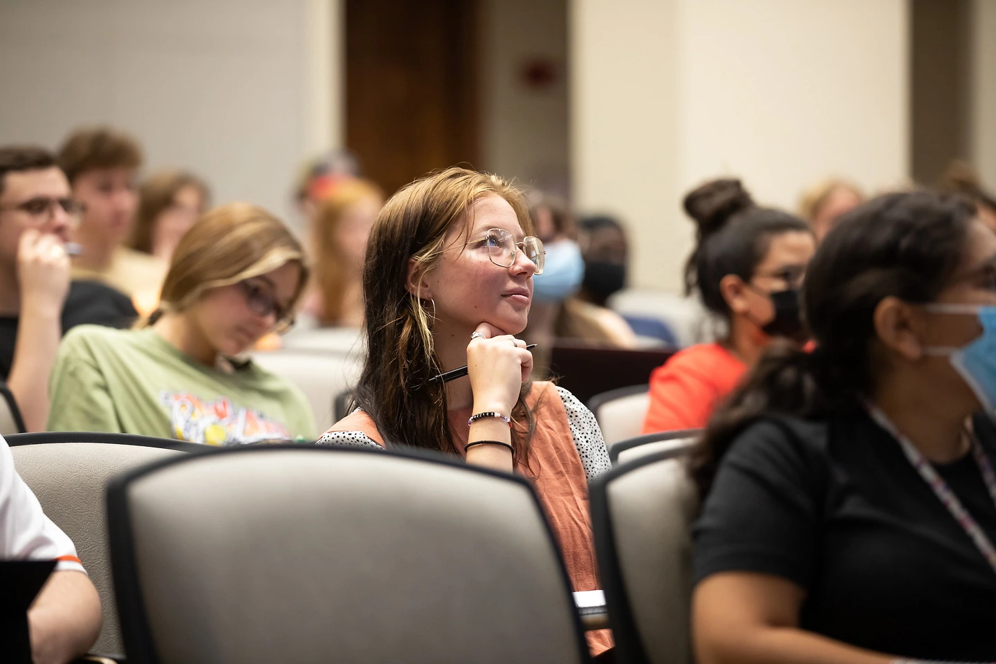 Female student in lecture hall.