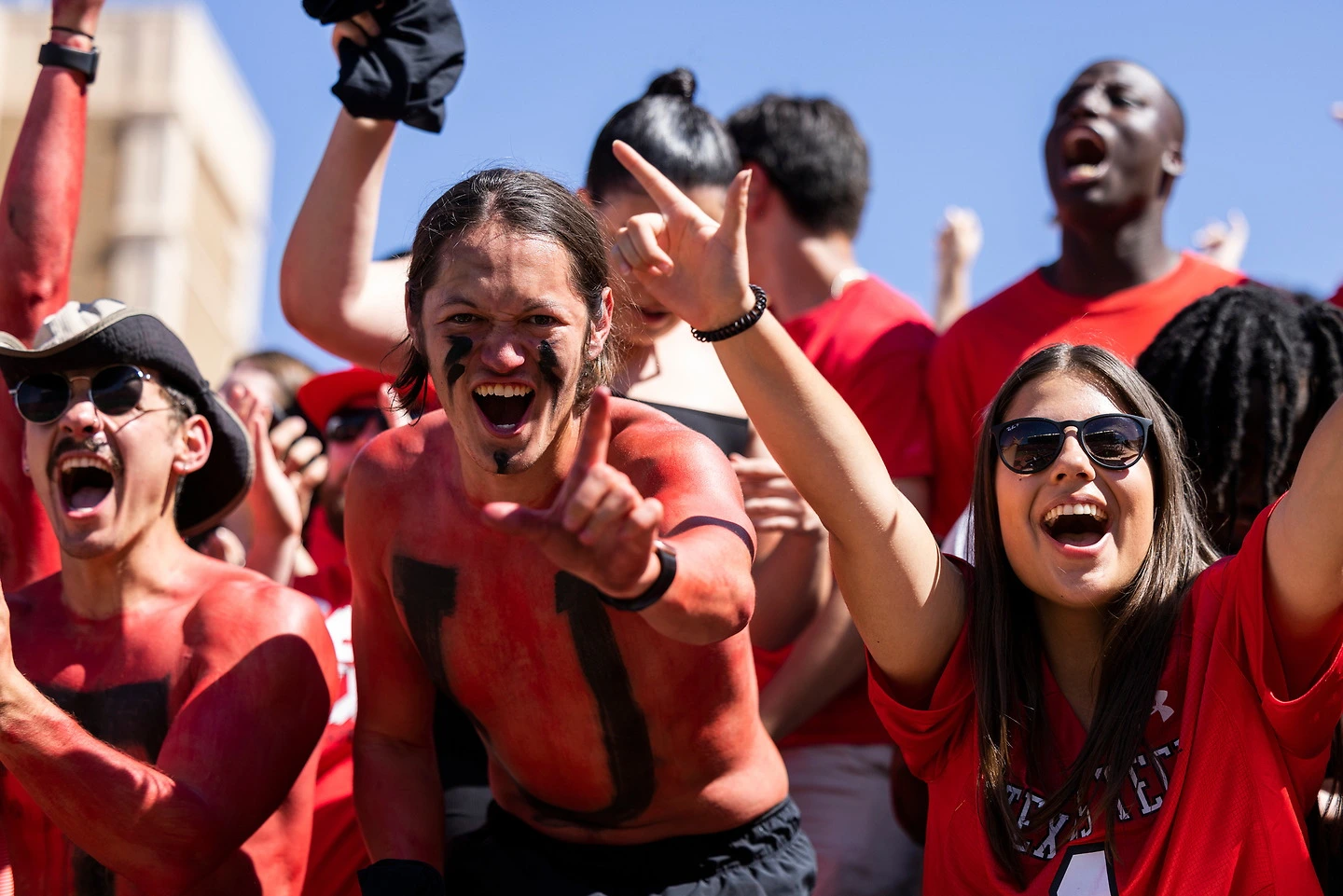 Students with painted faces at a game.