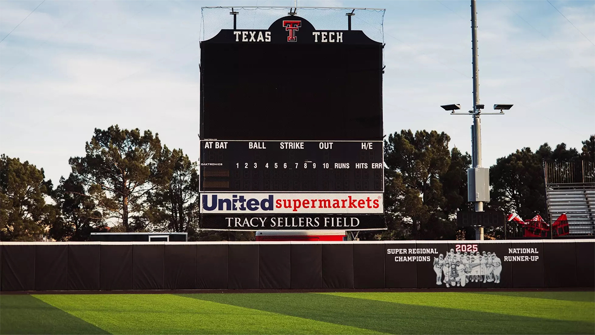 Texas Tech softball outfield in front of scoreboard, with the name 
