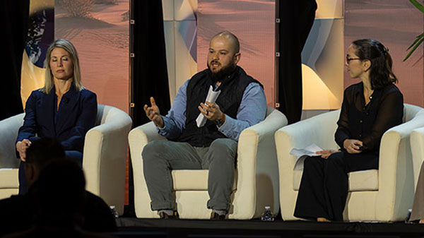 Bailey sitting on a panel with other guests