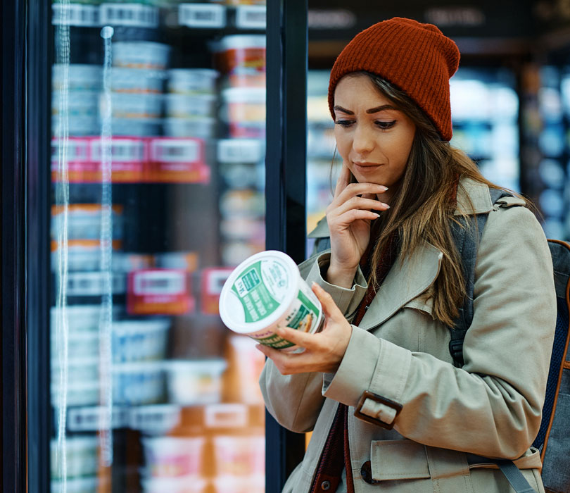 Girl reading food label
