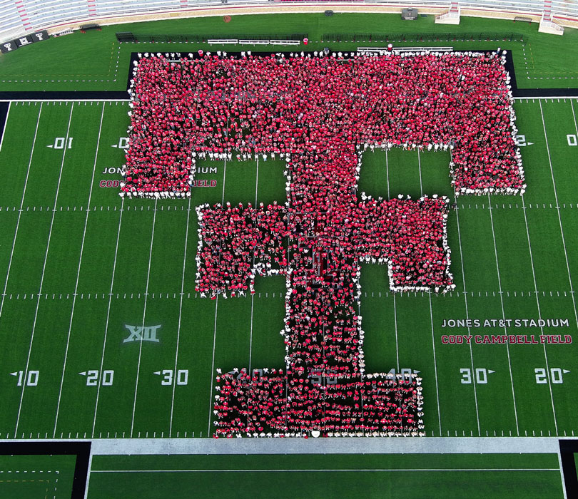 First Photo=First Year Students form a Double T on the 50 yard line of Jones AT&T Stadium 