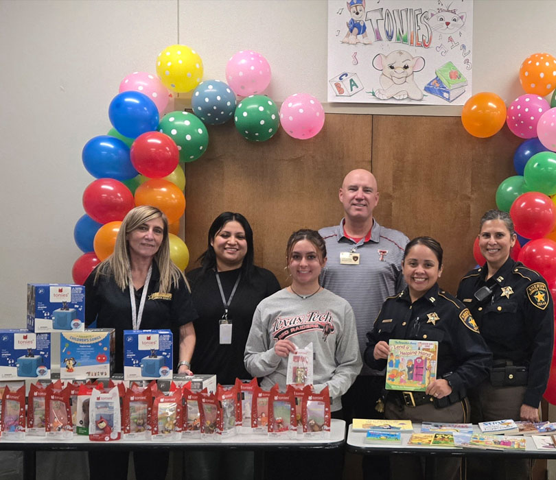 Detention Center Staff with books, etc