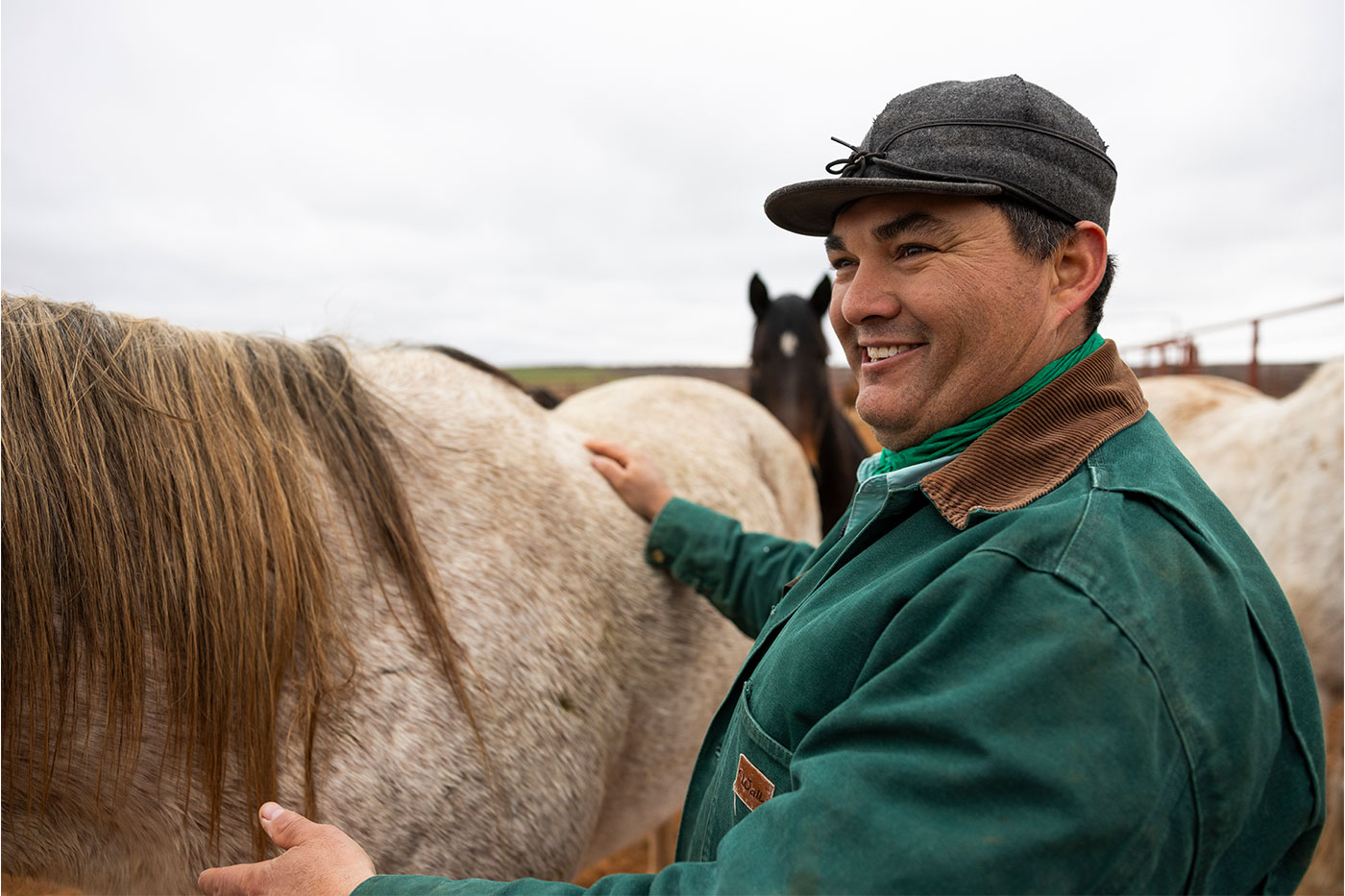 Jovani petting a horse.