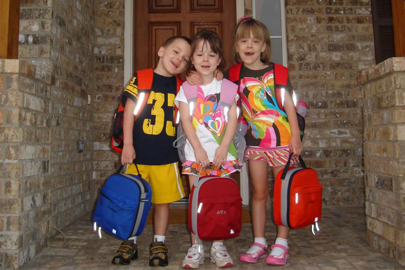 Triplets on their first day of school. 