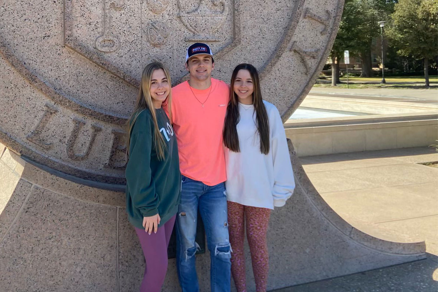 Triplets at the Texas Tech University seal. 
