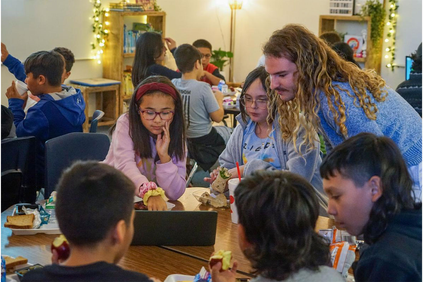Teacher working with students in a classroom