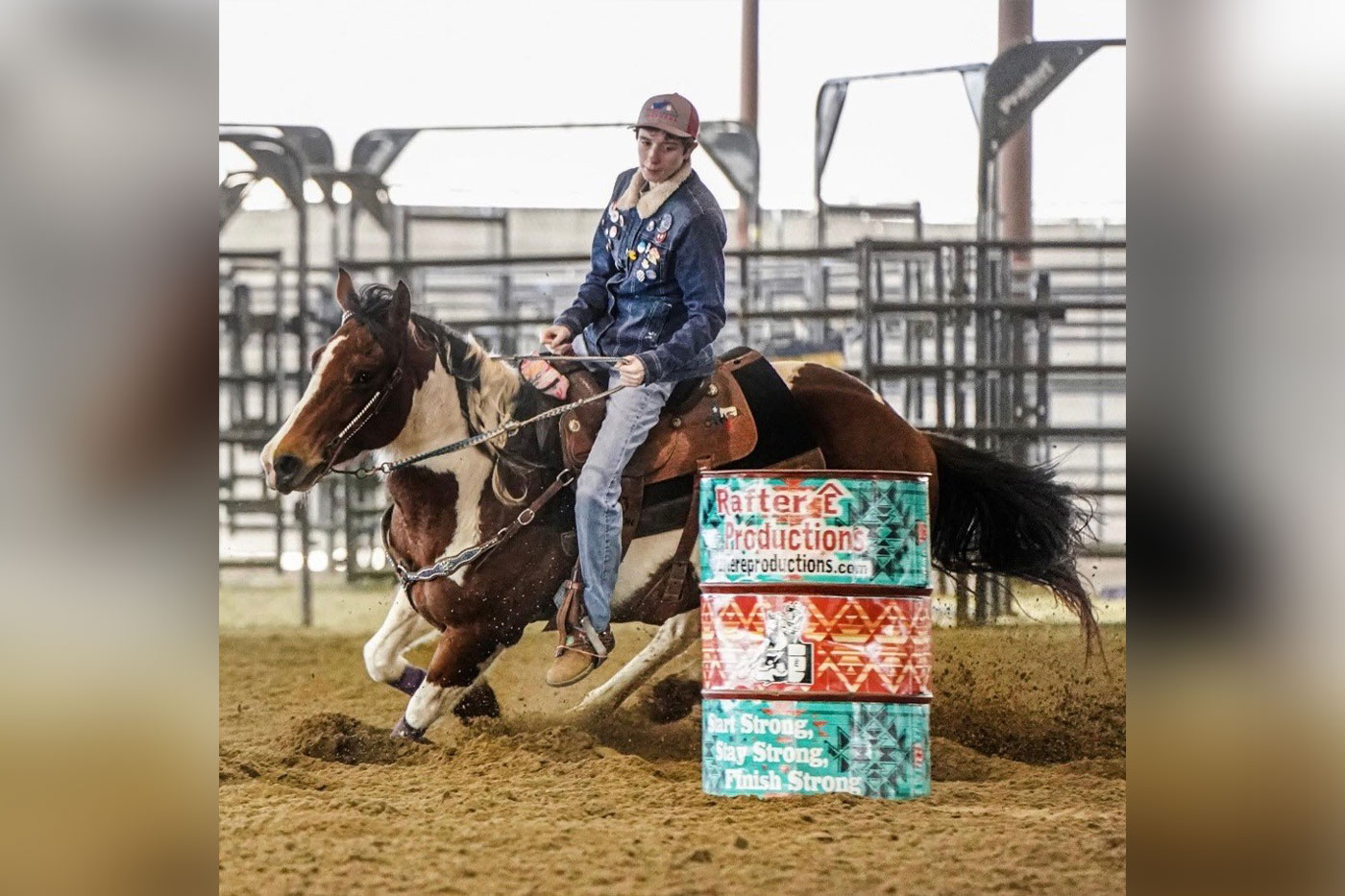 Jaycie riding a horse, barrel racing.