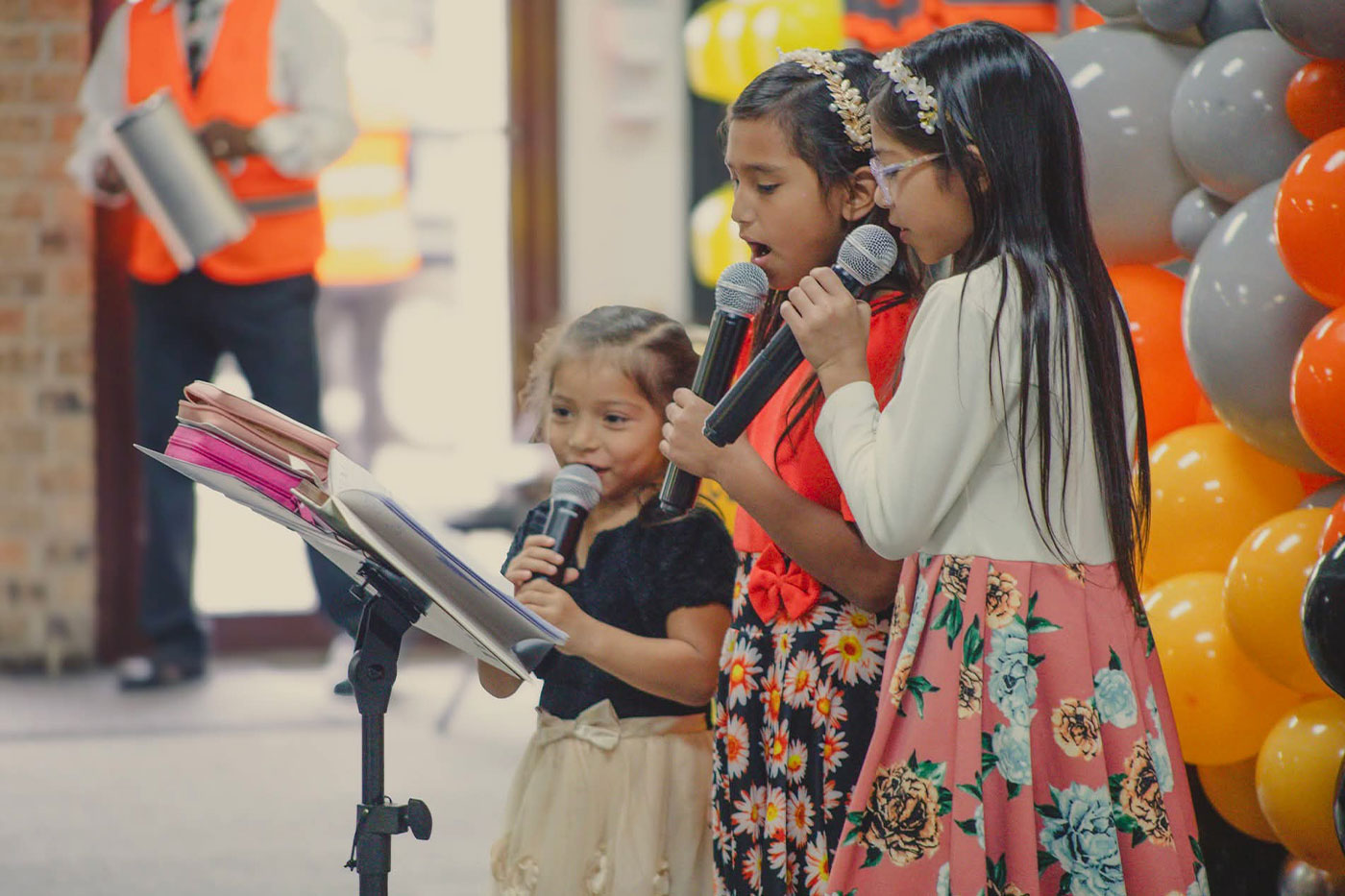  Neptalia (foreground) participates in a church event.