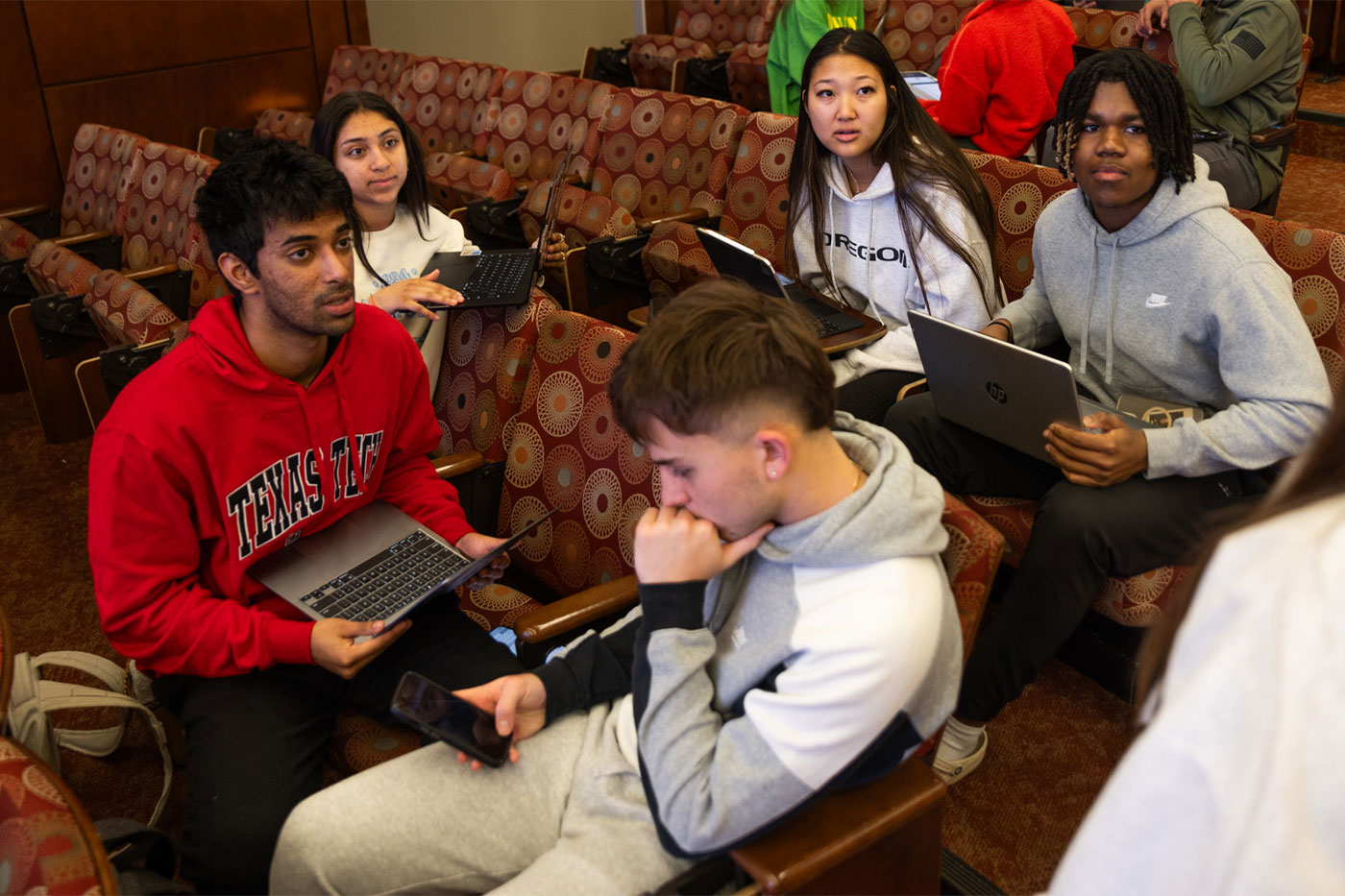 A learning assistant leads a small group discussion in a BA 1301 class. 