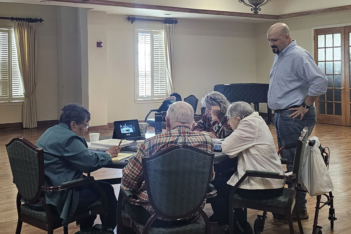 Helen and Tom, left and center, take instruction from Ibrahim Akdilek.
