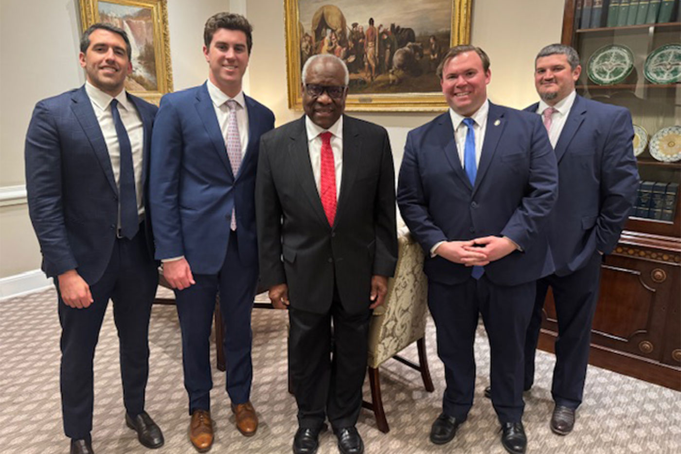 Andrew with Clarence Thomas and others
