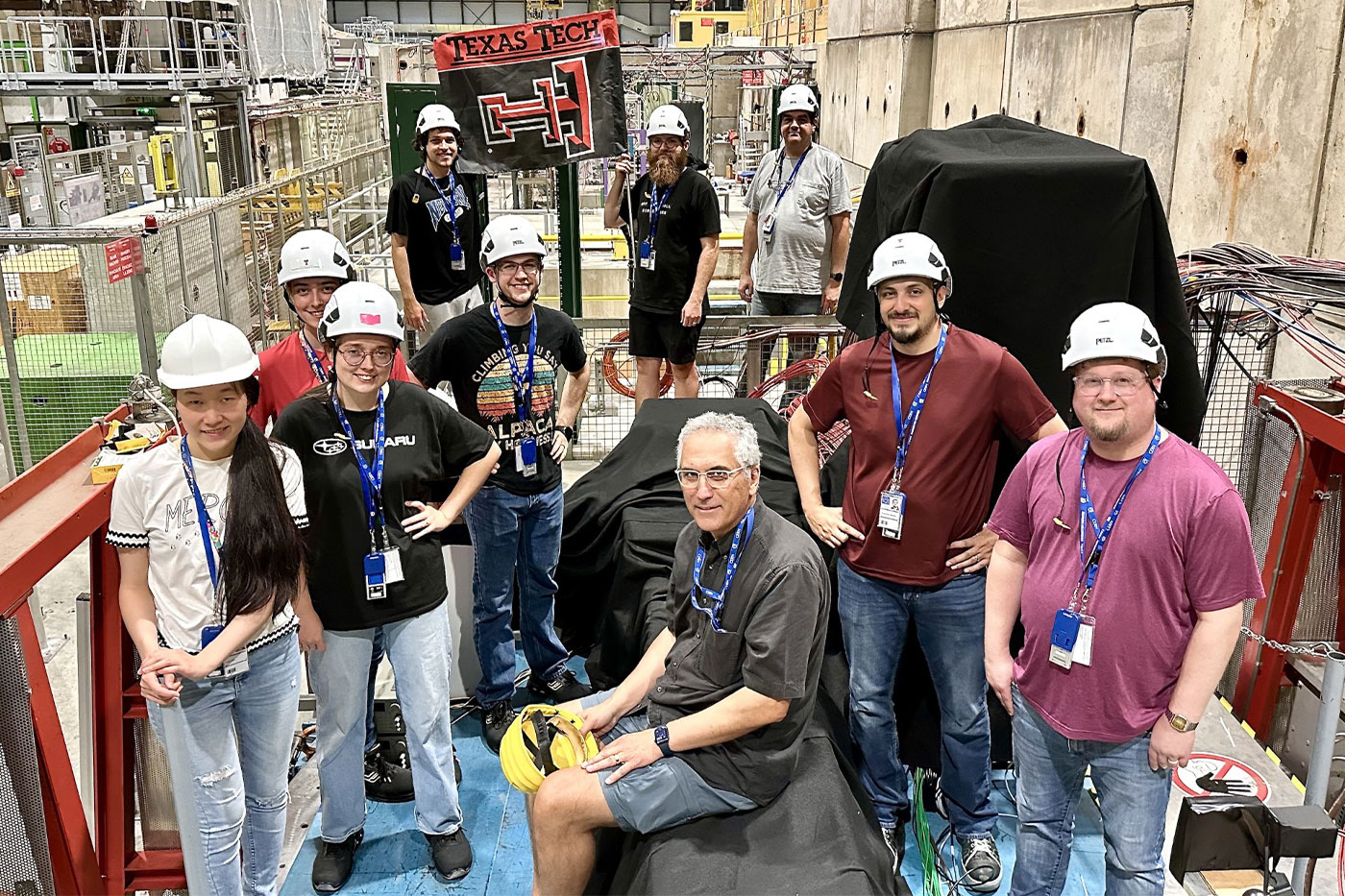 Students and faculty at CERN: First row from left: Weijie Jin, Caitlin Tidmore, Nural Akchurin (center), Christopher Madrid, Mitch Kelley. Second row: Elizabeth Veraa, Harry Brittan. Third row: Miles Harris, Xander Delashaw, Jordan Damgov.