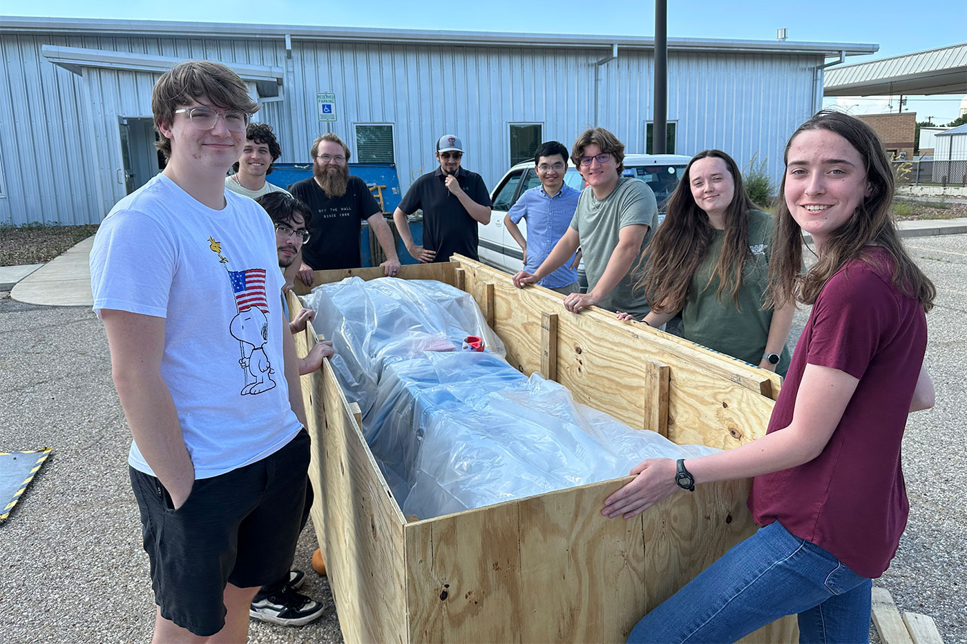 Colin Nunn, Zen Leon-Guerrero, Miles Harris, Xander Delashaw, Chris Madrid, Yongbin Feng, Michael O’Donnell, Caitlin Tidmore and Elizabeth Veraa help ready the detector for shipping.