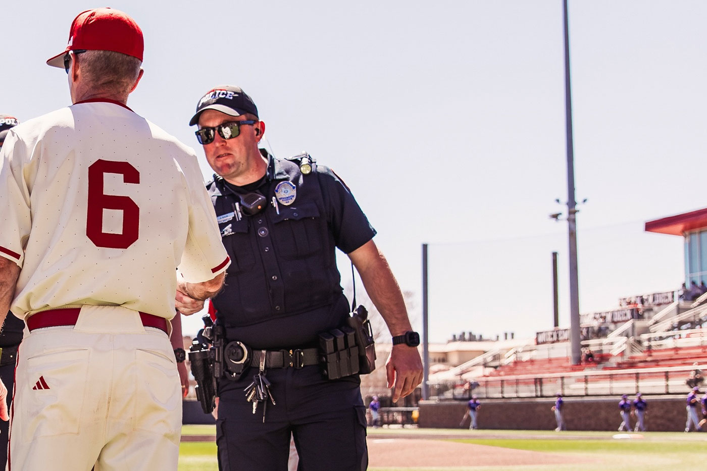 Jeff shaking hands on baseball field