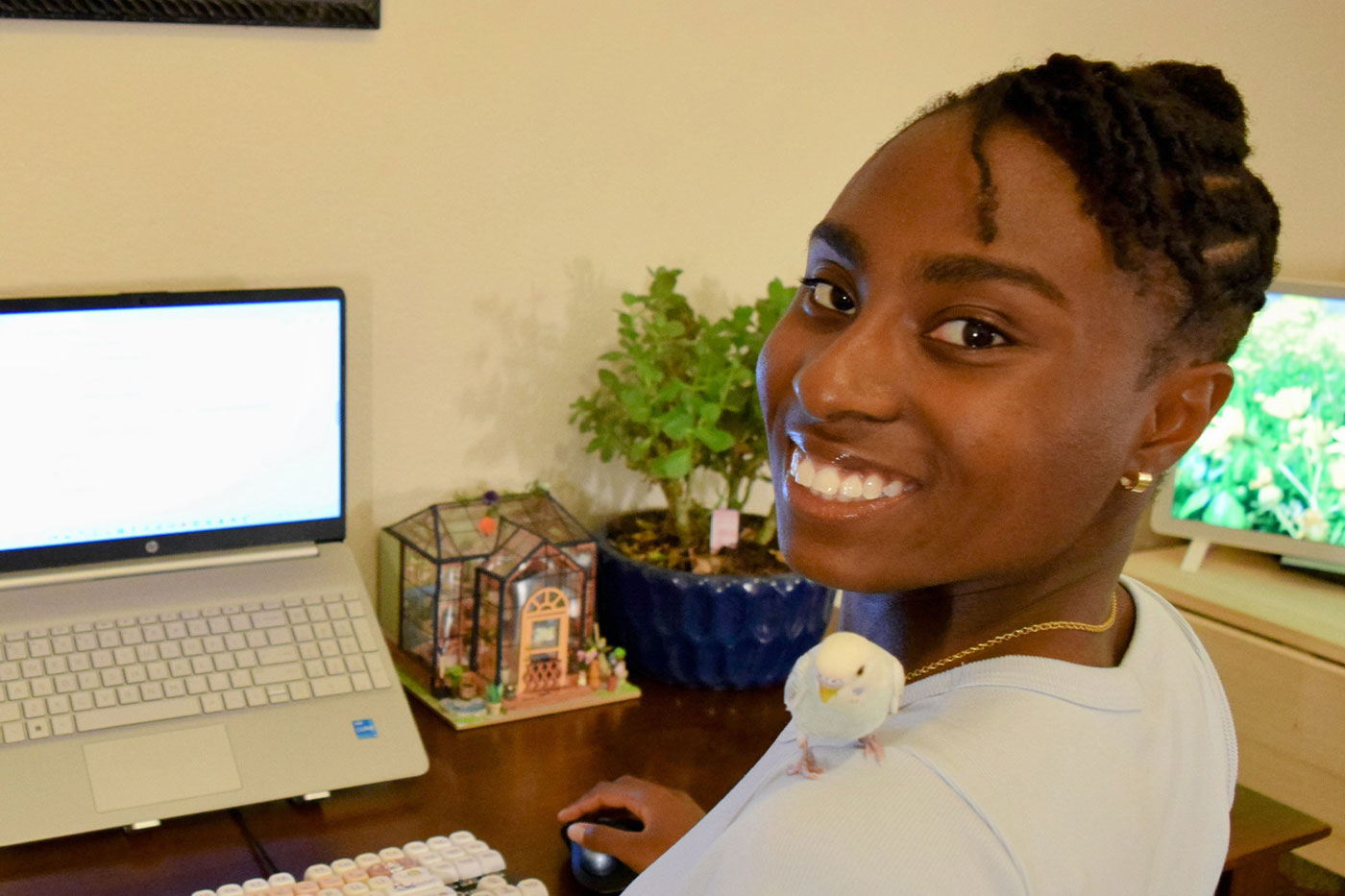 she takes care of her pet parakeet, Milo