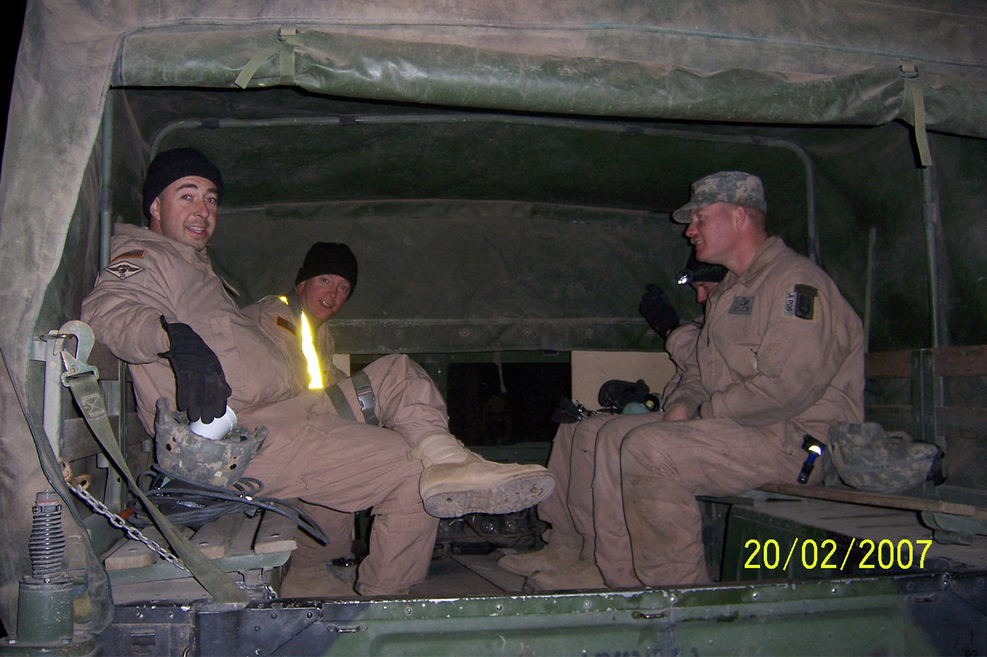Mason, sitting front left, and his flight crew for the day in 2007 in Balad, Iraq. 