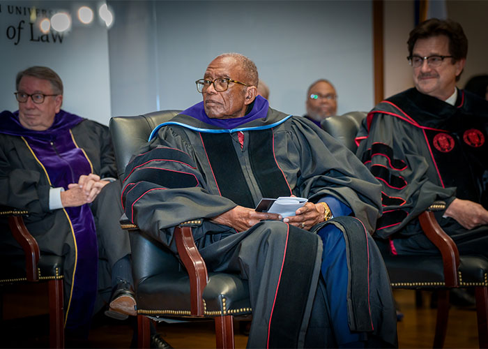 Fred Gray with President Schovanec seated to his left. 