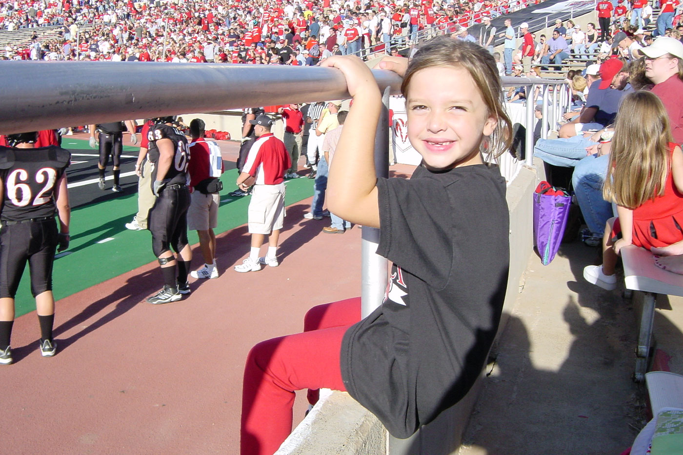 Gini as a child at a Texas Tech University football game. 