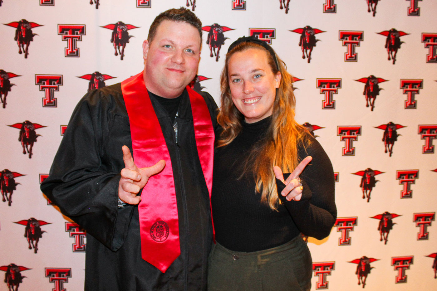 Jeramiah with adviser Annalisa Clark at the Waco graduation celebration.