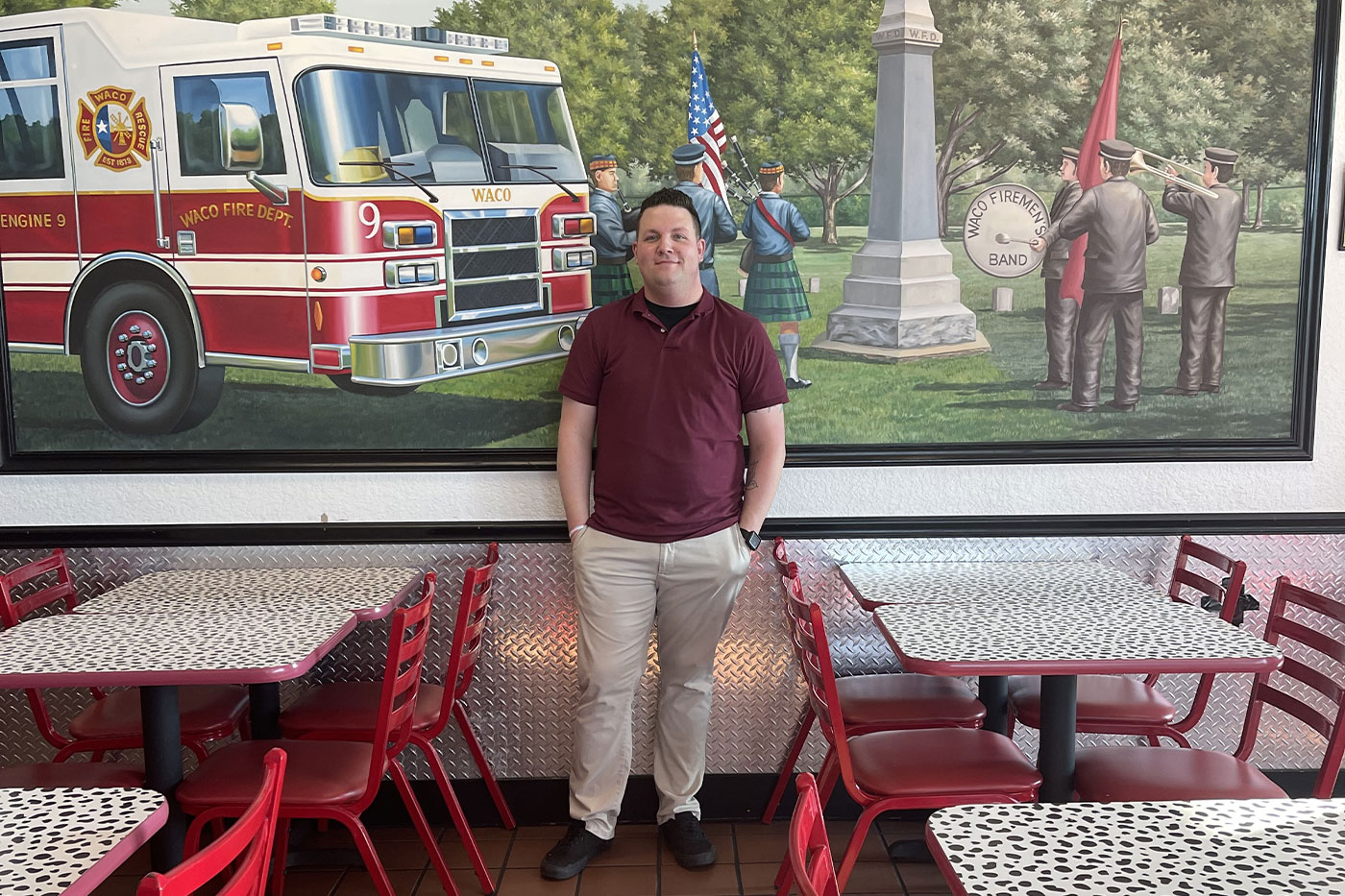 Jeramiah inside a Firehouse restaurant.