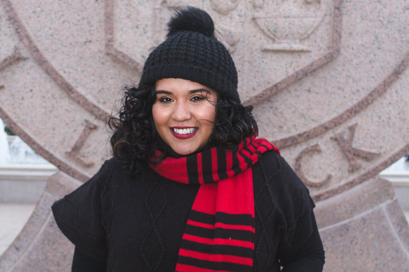 Norma in front of the TTU seal