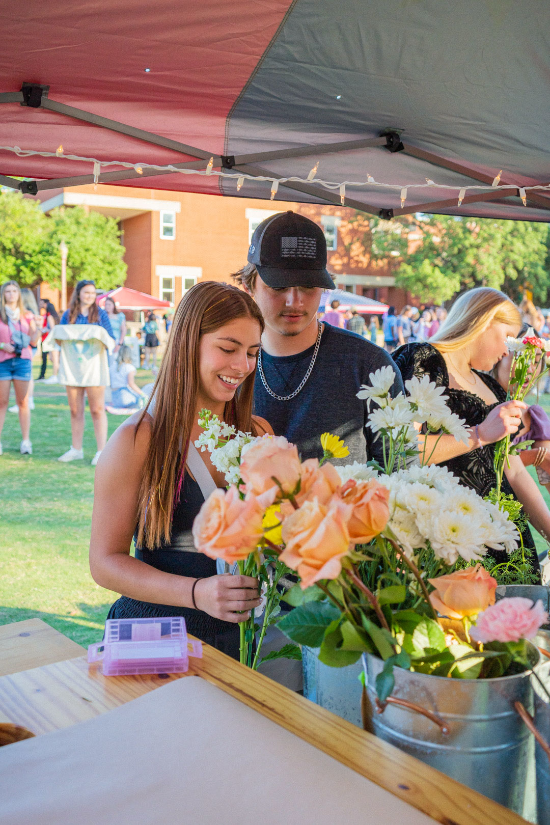 Young couple looking at flowers. 