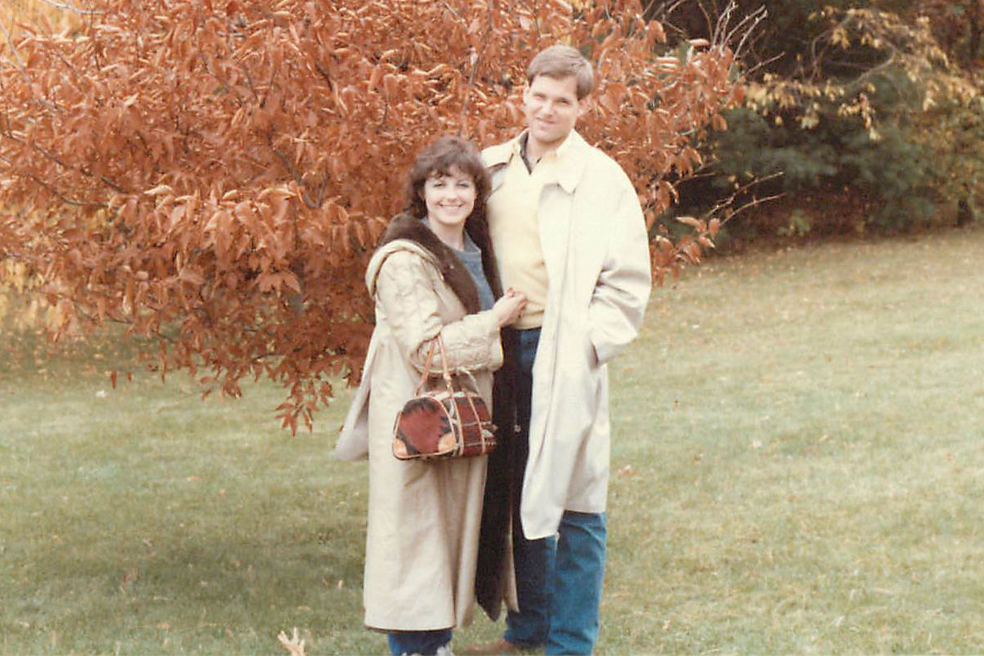 Laura and Pat outdoors in autumn. 