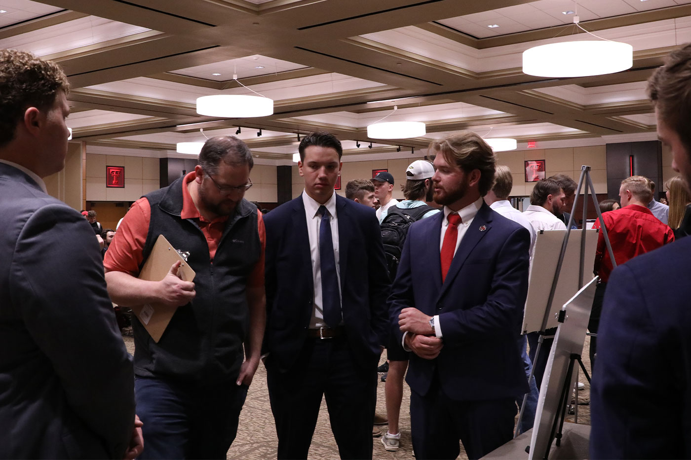 Students standing in ballroom at Mackenzie Merket Alumni Center