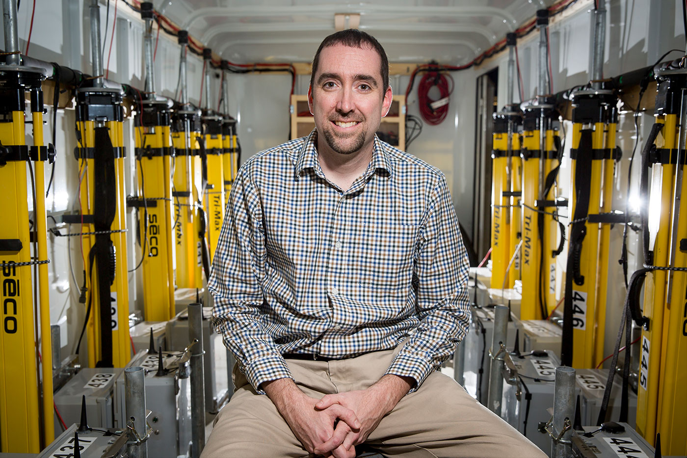 Chris Weiss sitting among tornado StickNets. 