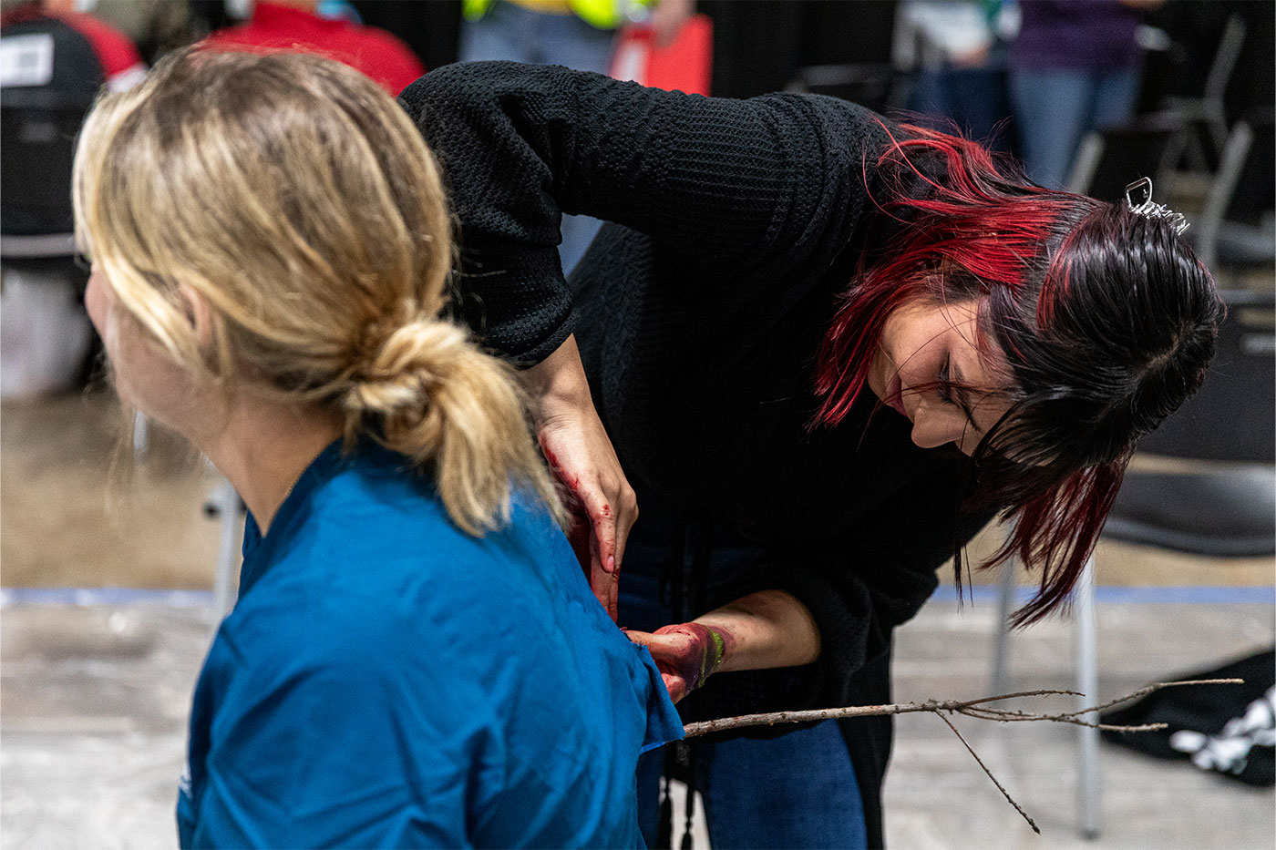 Theatre student applying props