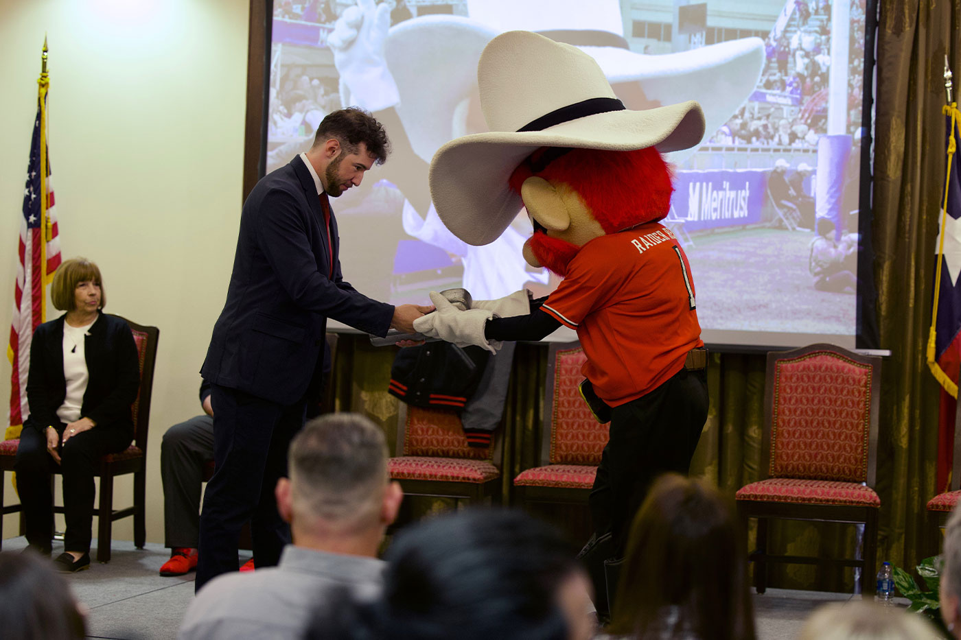 Holden Jackola congratulates his Raider Red successor. 