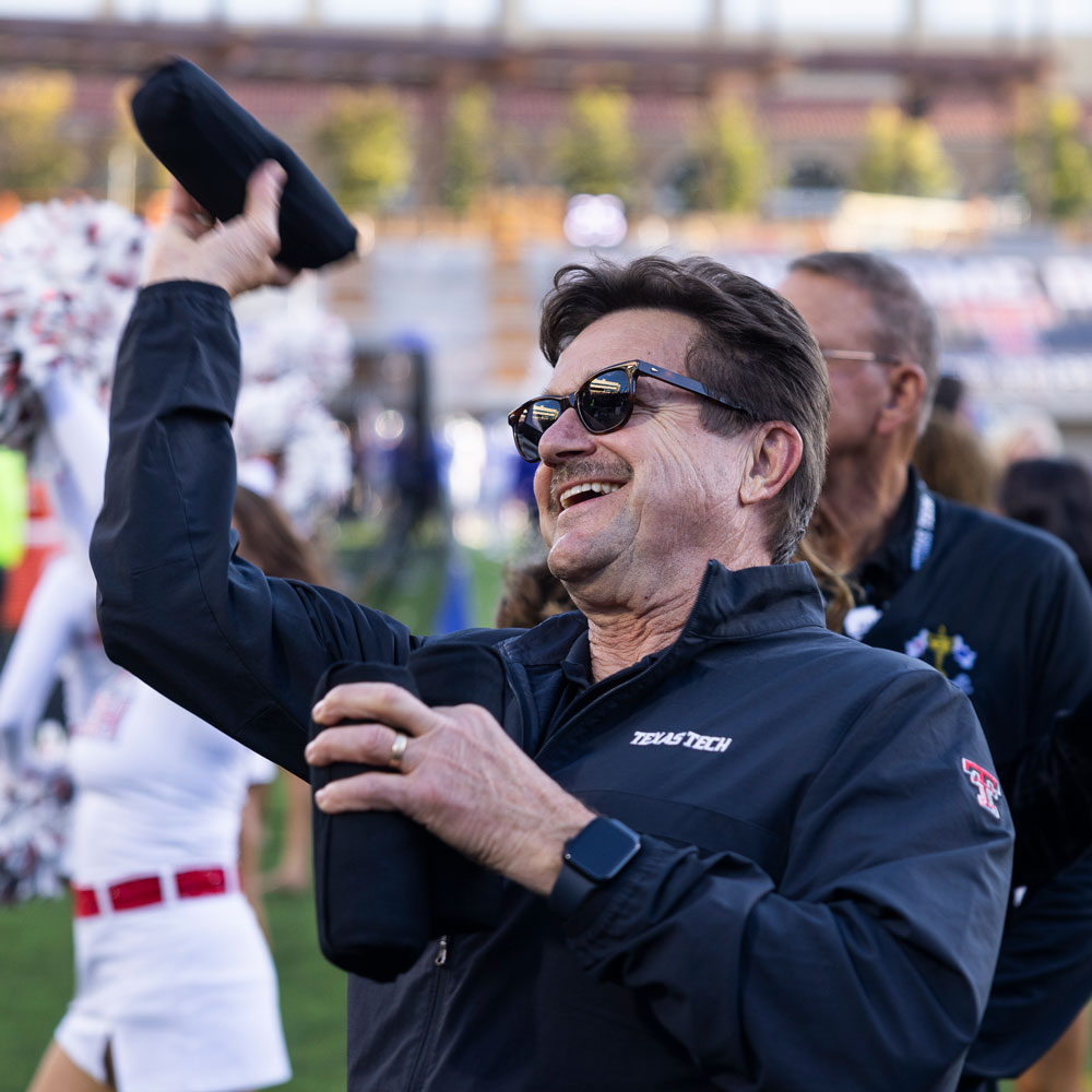 President Lawrence Schovanec throwing a t-shirt to the crowd