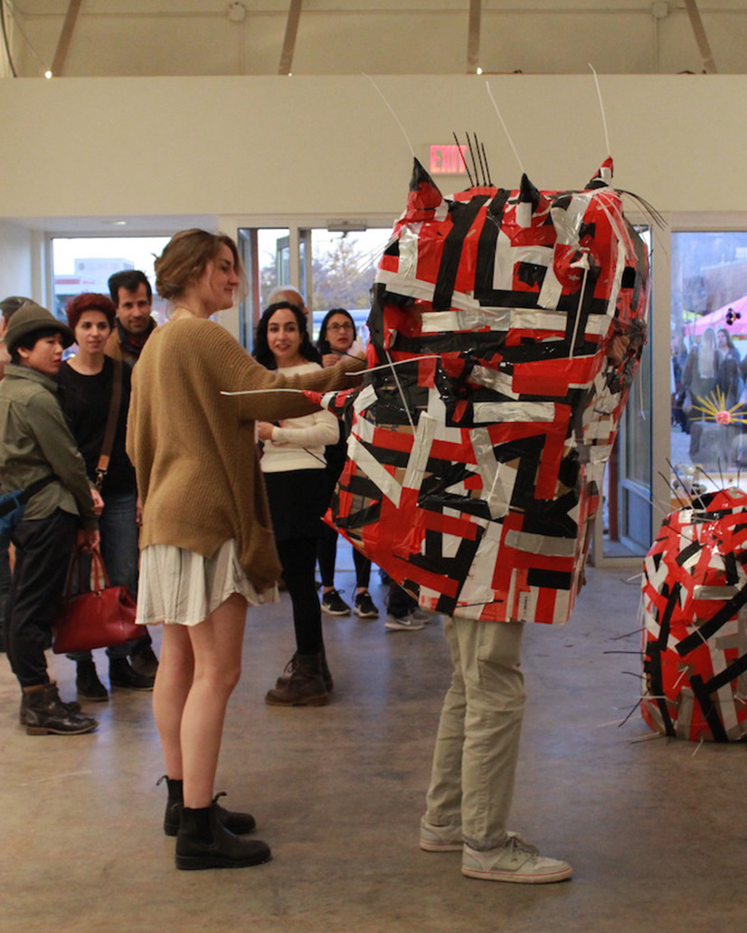 students viewing art in a gallery space.