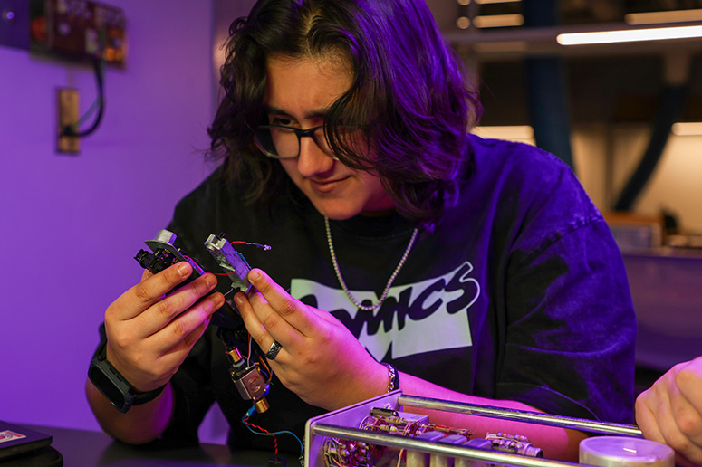 A student works on an electronics project.