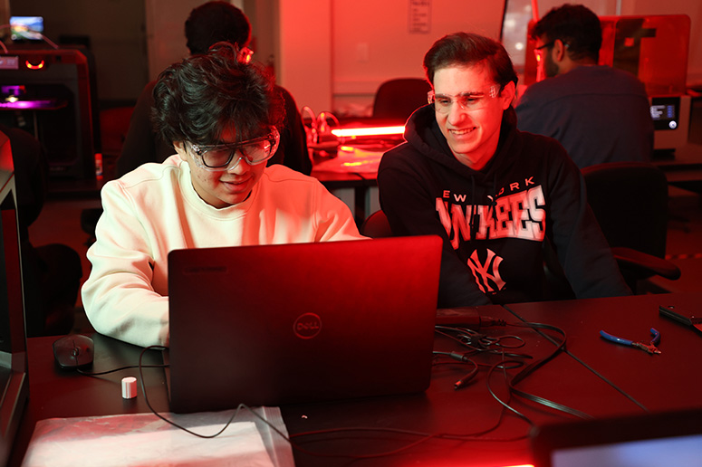 Students working in a 3d printing lab.