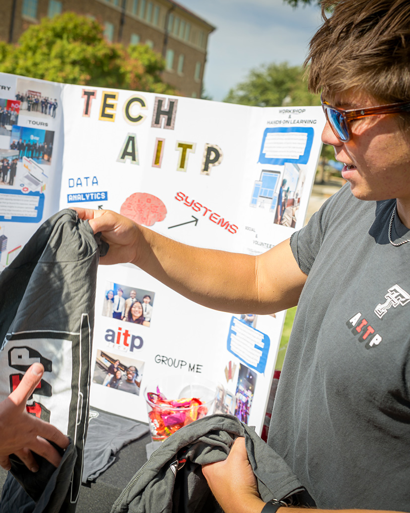 AITP students networking with technology professionals at a campus event