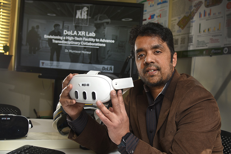 Muntazar Monsur, Ph.D. with VR headset