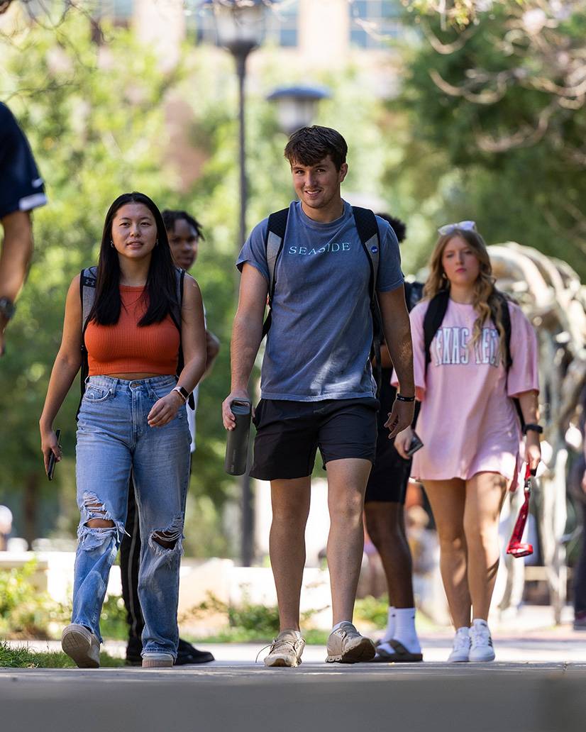 Students walking together on campus.