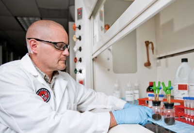 Scientist checking containers